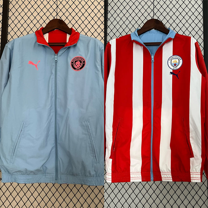 Manchester City. Cortaviento reversible Celeste/Rojo